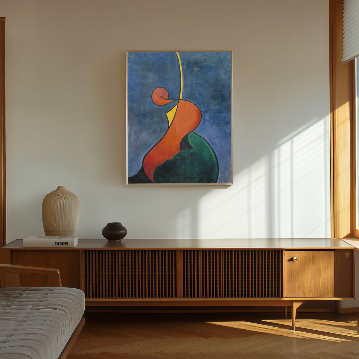 Framed art print of Mouvement héroïque by Theo van Doesburg, in a thin light frame on a sunlit wall above a wooden sideboard