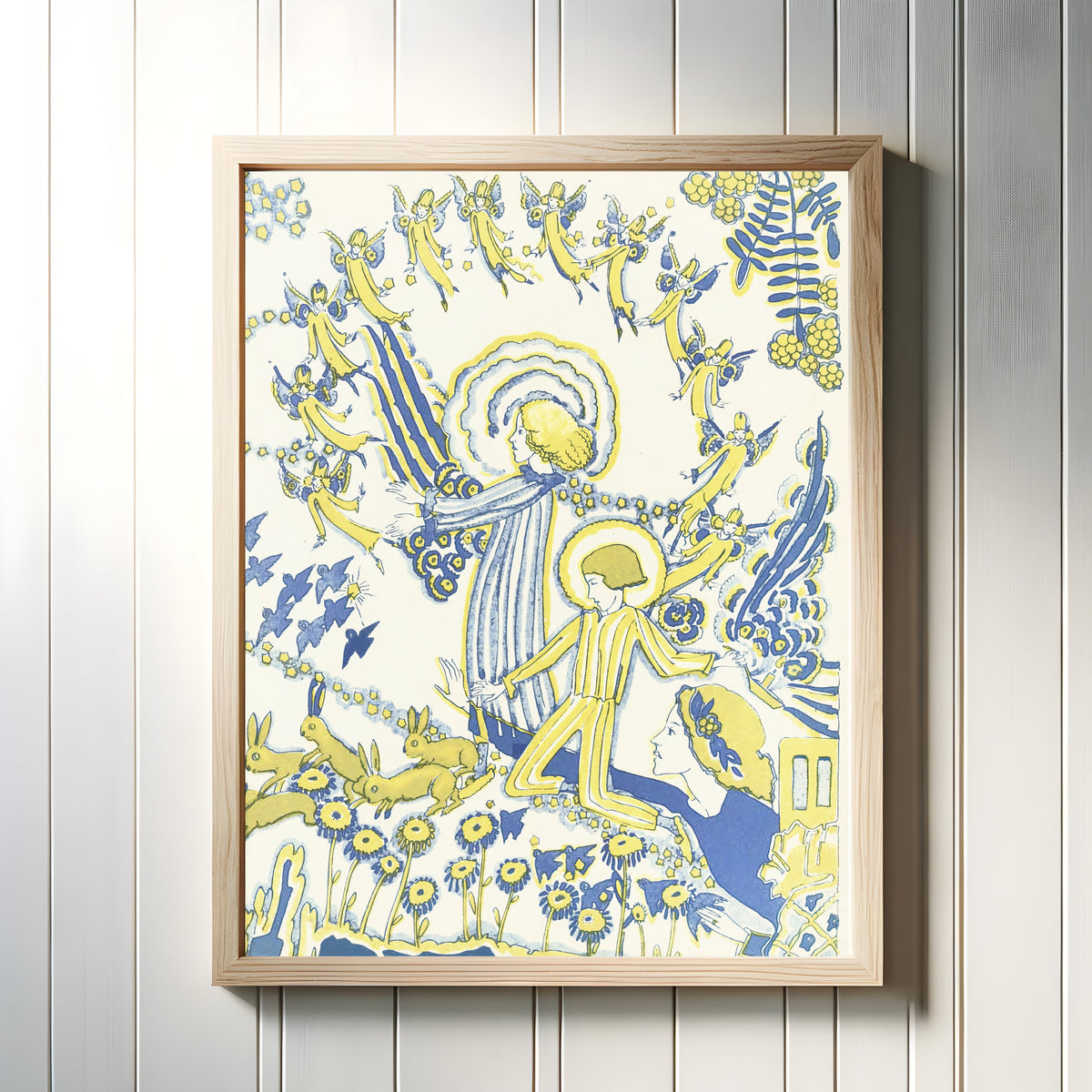 Framed art print of Mummy's Bedtime Story Book: Plate 12 by Jessie M. King, in a light wood frame on a white panelled wall