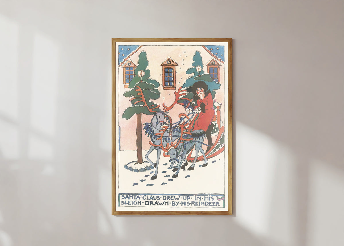 Framed art print of Mummy's Bedtime Story Book: Santa Claus Drew Up in His Sleigh Drawn by His… by Jessie M. King, in a light wood frame on a sunlit white wall