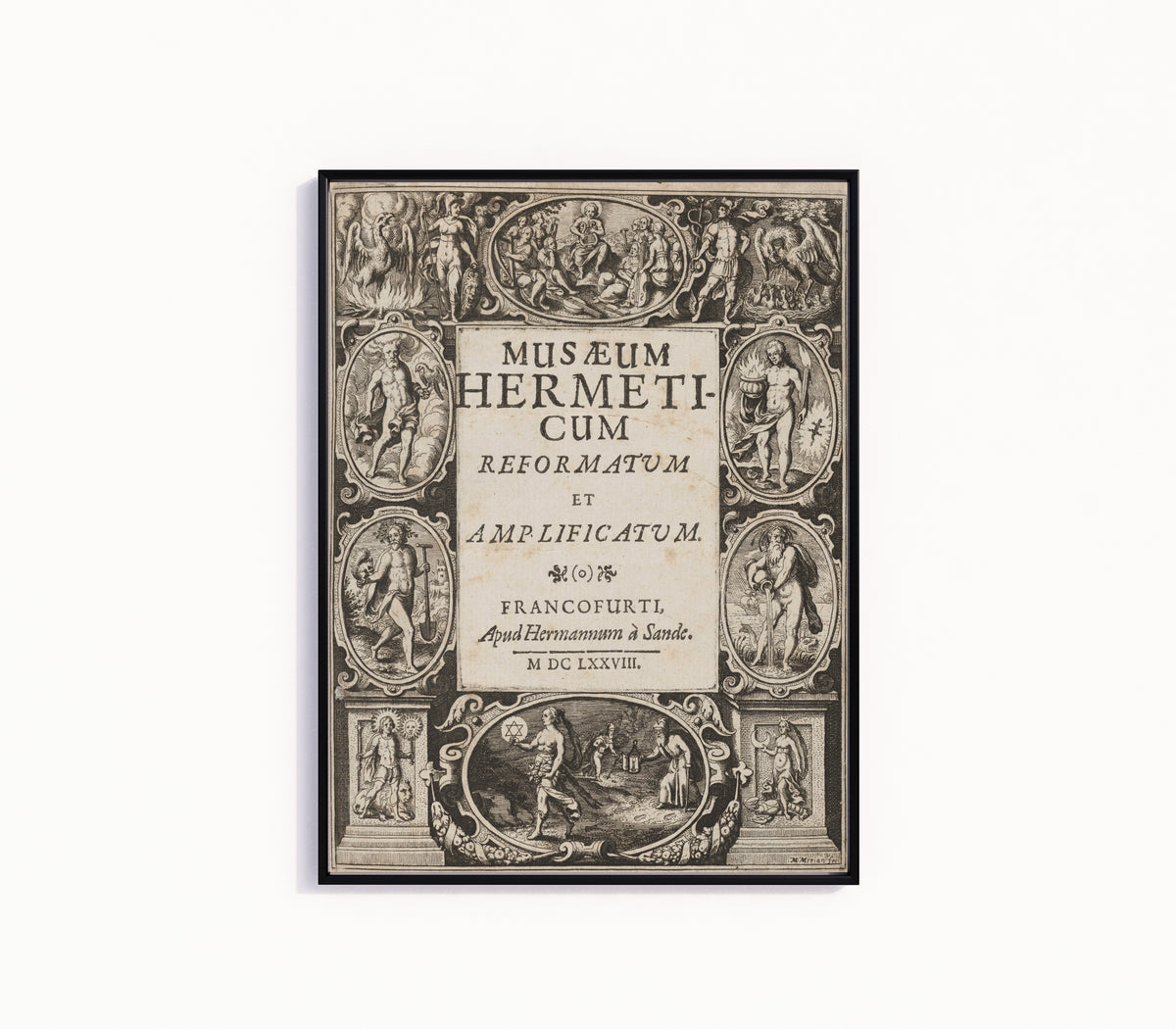 Framed art print of Musaeum Hermeticum: Engraved Title Page by Matthäus Merian, in a slim black frame on a plain white wall