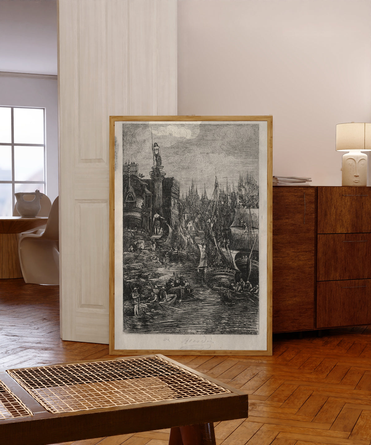 Framed art print of My Dream by Rodolphe Bresdin, in a light wood frame leaning in a warm room with a parquet floor