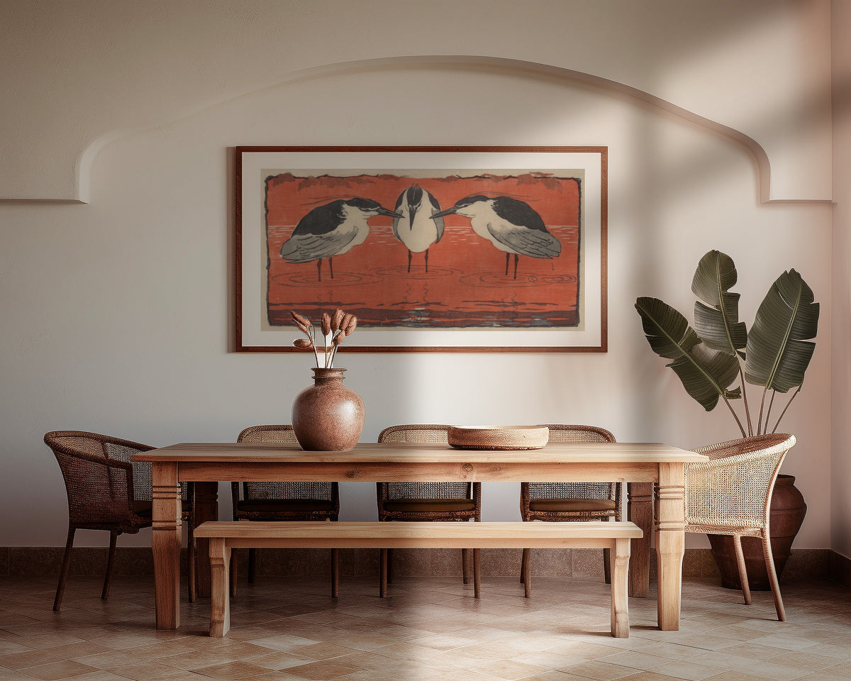 Framed art print of Nachtreiher (Drei Philosophen) by Otto Eckmann, above a wooden dining table