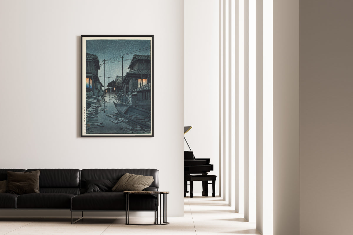 Framed art print of Night Rain at Kawarago by Kawase Hasui, on the wall of a minimal living room