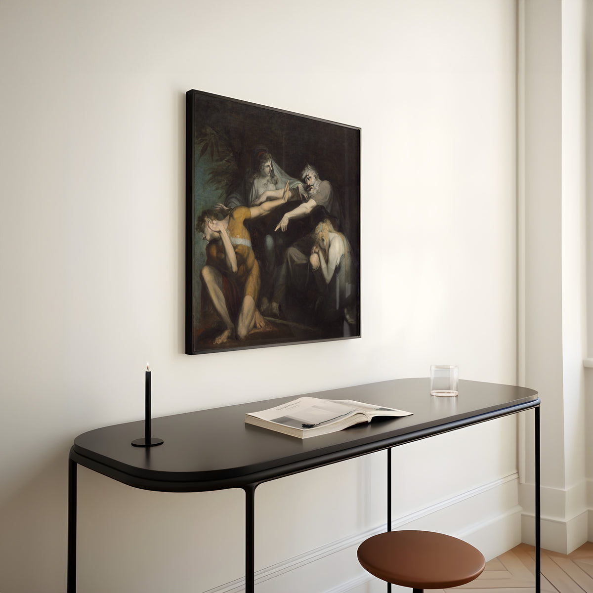 Framed art print of Oedipus Cursing His Son, Polynices by Henry Fuseli, above a slim black console table