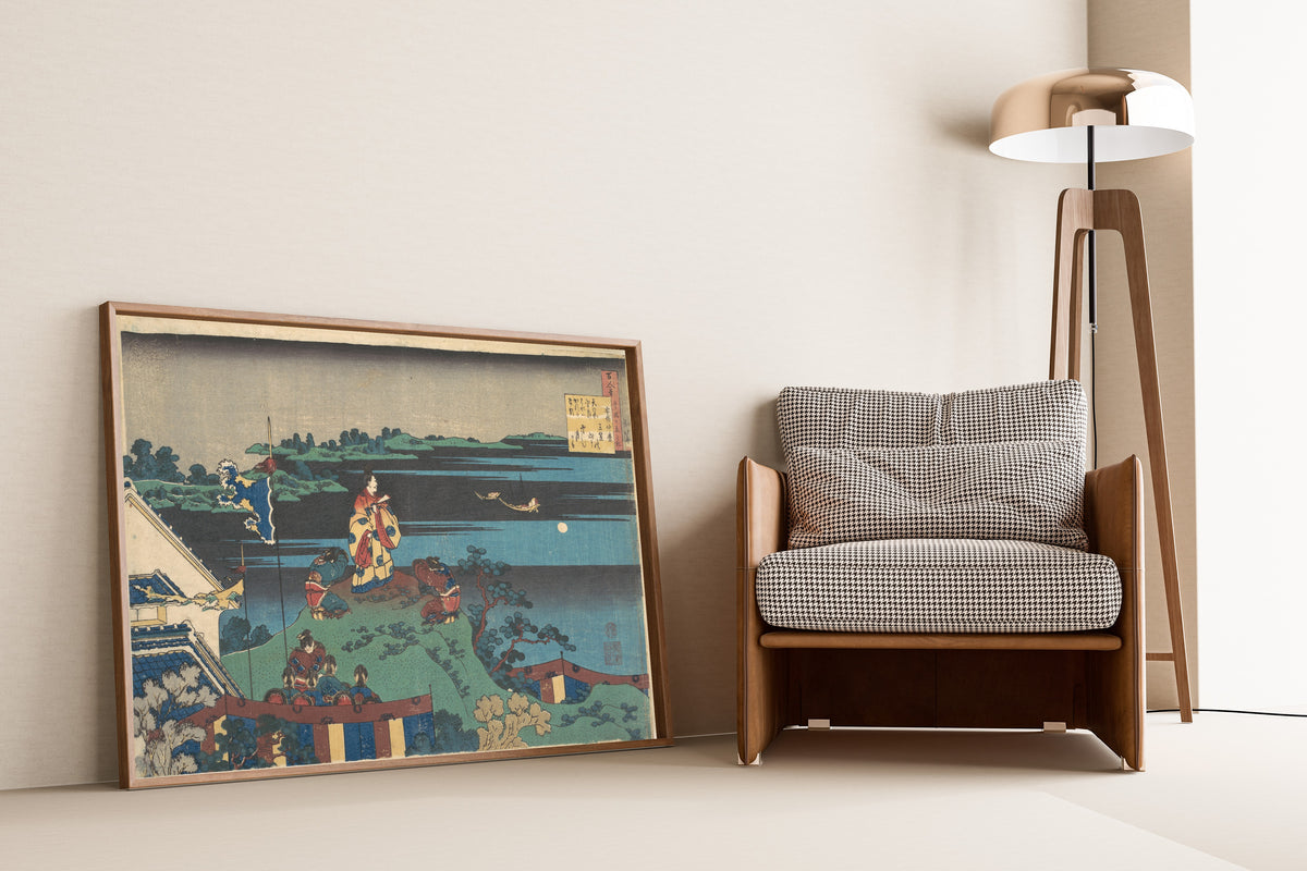 Framed art print of One Hundred Poems Explained by the Nurse: Poem by Abe no… by Katsushika Hokusai, leaning against a wall beside an armchair and a floor lamp