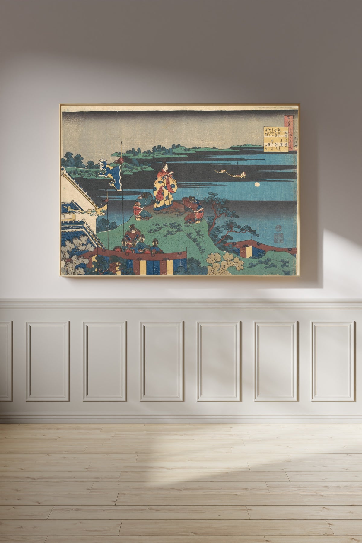 Framed art print of One Hundred Poems Explained by the Nurse: Poem by Abe no Nakamaro by Katsushika Hokusai, on a panelled wall in afternoon light