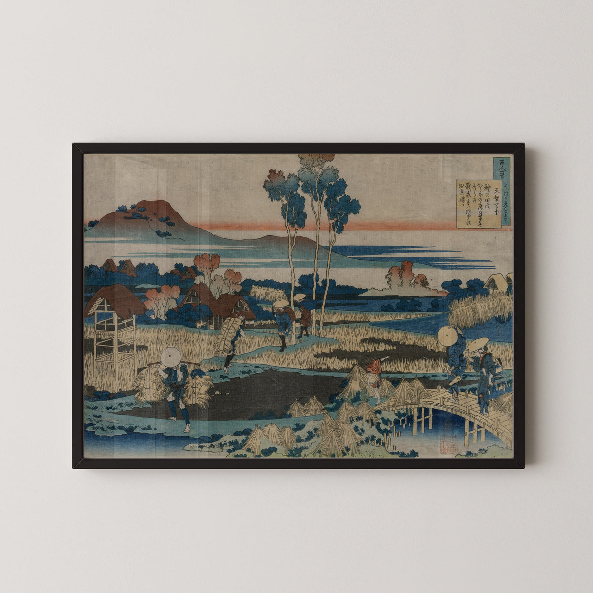 Framed art print of One Hundred Poems Explained by the Nurse: Poem by Emperor Tenchi by Katsushika Hokusai, in a black frame on a pale wall