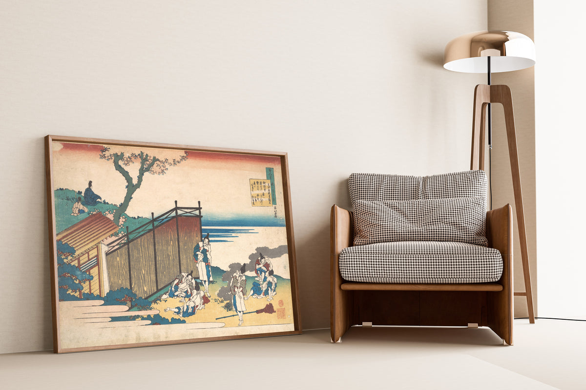 Framed art print of One Hundred Poems Explained by the Nurse: Poem by… by Katsushika Hokusai, leaning against a wall beside an armchair and a floor lamp