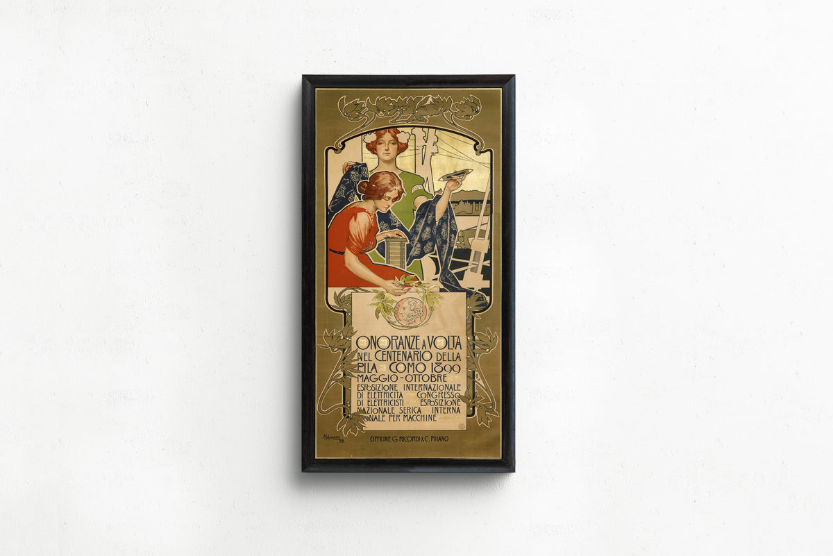 Framed art print of Onoranze a Volta nel Centenario della Pila, Como 1899 by Adolfo Hohenstein, in a slim black frame on a plain white wall