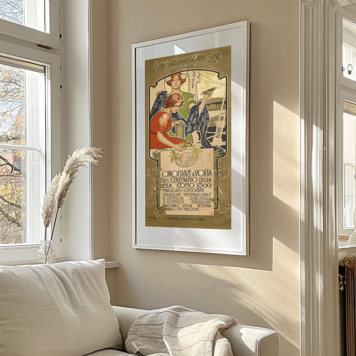 Framed art print of Onoranze a Volta nel Centenario della Pila, Como 1899 by Adolfo Hohenstein, in a sunlit living room above a sofa