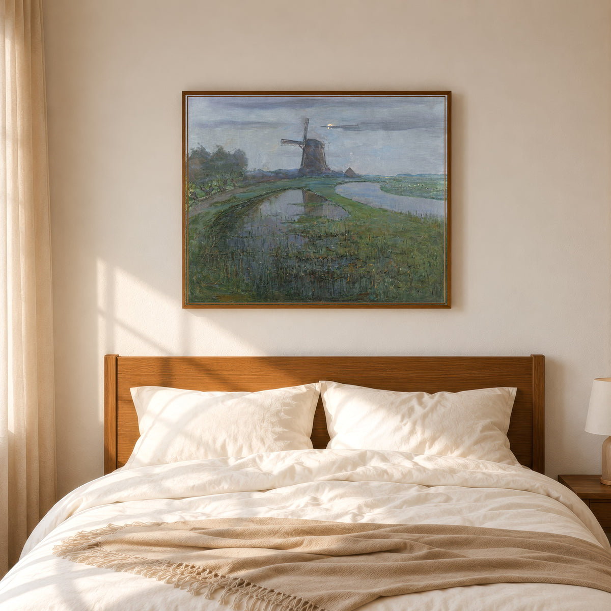 Framed art print of Oostzijdse Mill along the River Gein by Moonlight by Piet Mondrian, in a slim wood frame above a bed in a sunlit bedroom