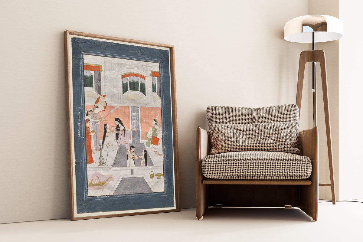 Framed art print of Palace Women Enjoy Music by the Side of a Cascade by Pahari school, leaning against a wall beside an armchair and a floor lamp