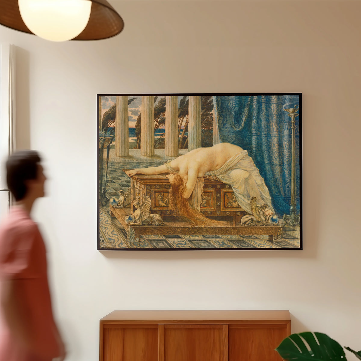 Framed art print of Pandora by Walter Crane, in a slim black frame on a warm wall in a sunlit room