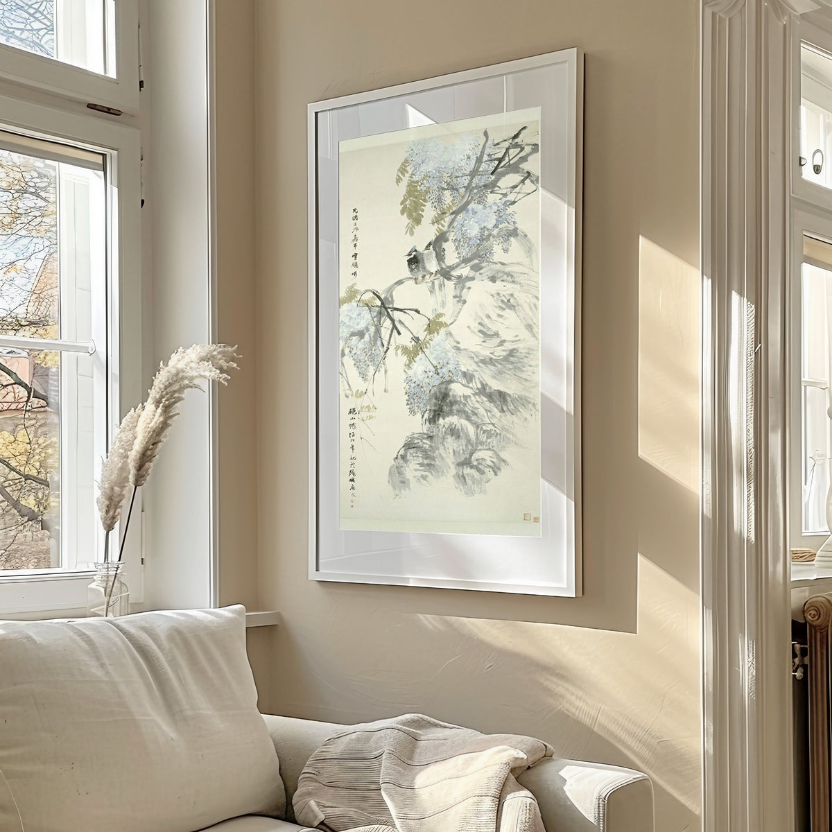 Paradise Flycatchers and Wisteria by Ren Yi — framed in a sunlit living room above a sofa