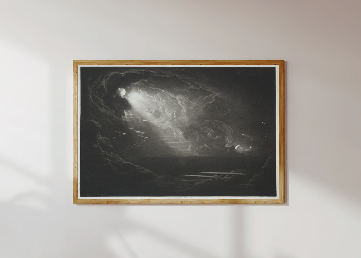 Framed art print of Paradise Lost: The Creation of Light by John Martin, in a light wood frame on a sunlit white wall