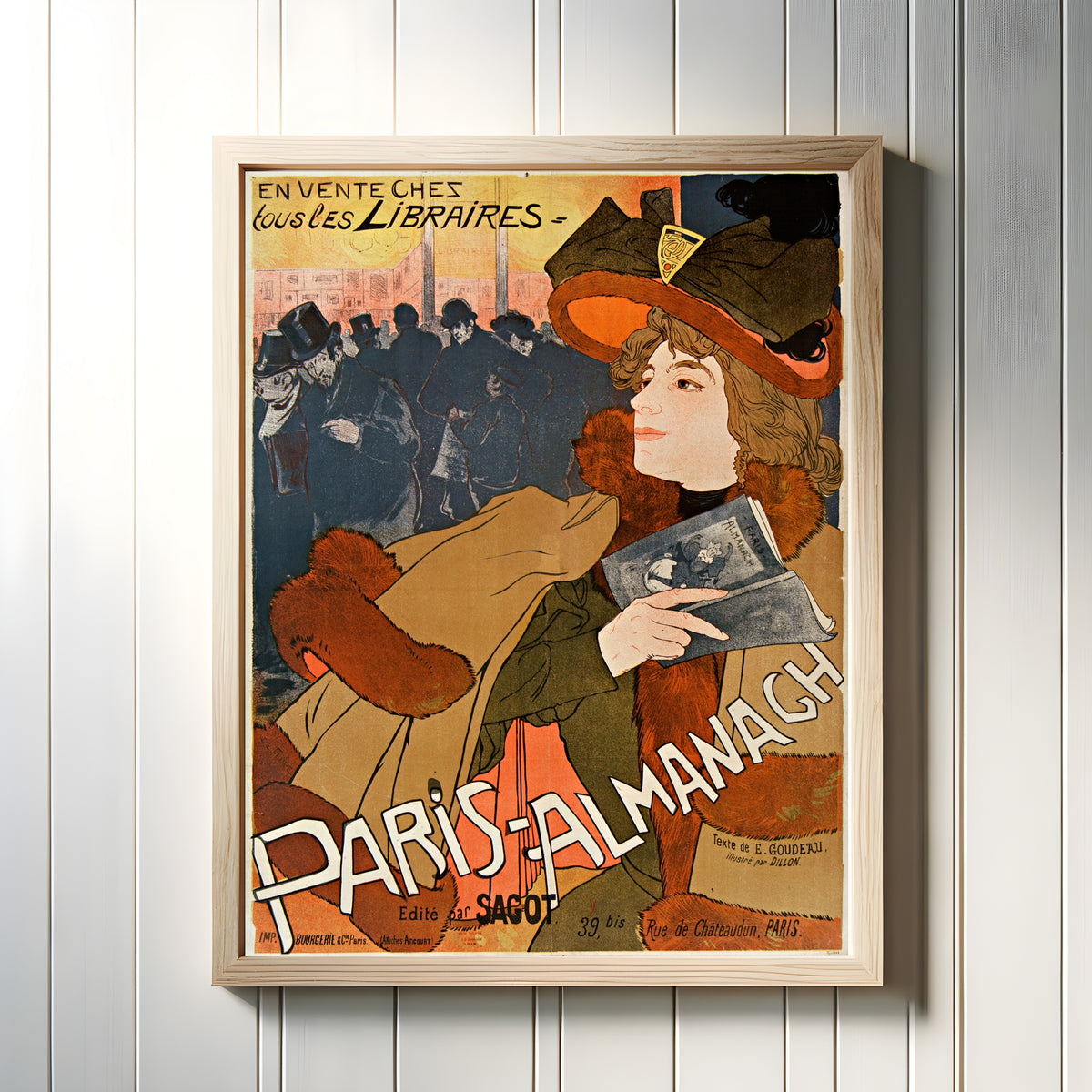 Framed art print of Paris-Almanach by Georges de Feure, in a light wood frame on a white panelled wall