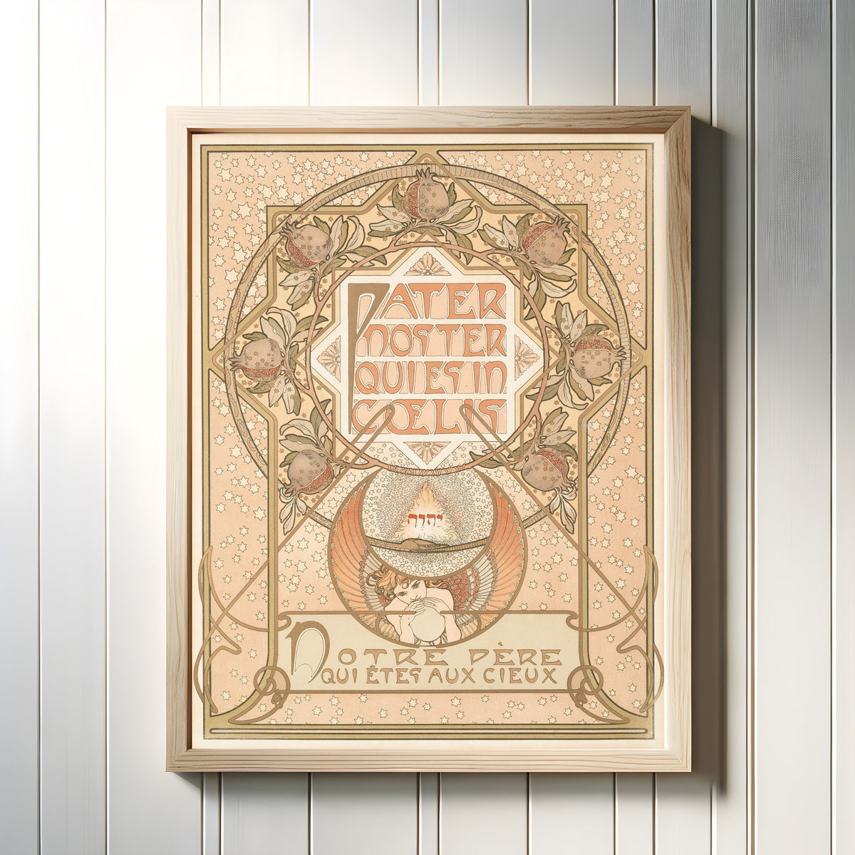 Framed art print of Pater Noster by Alphonse Mucha, in a light wood frame on a white panelled wall