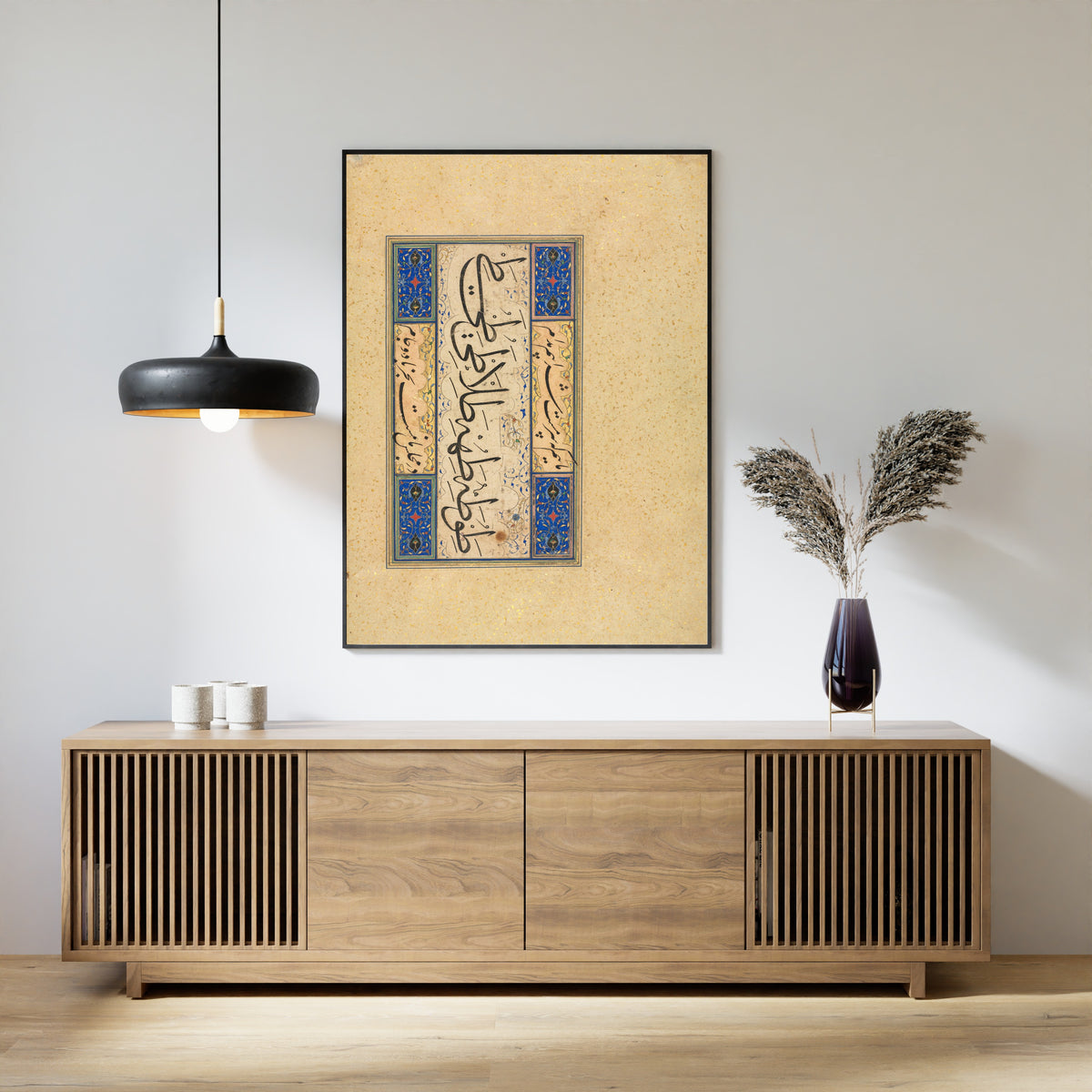 Framed art print of Persian Verse (Khamriyya), above a slatted wood sideboard
