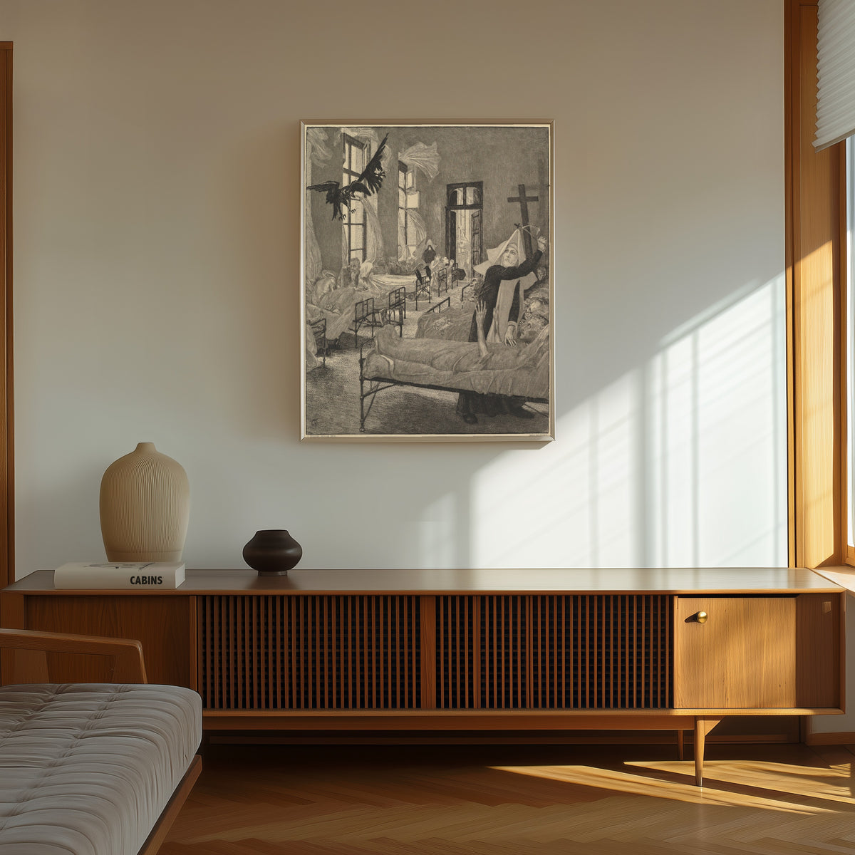 Framed art print of Pest by Max Klinger, in a thin light frame on a sunlit wall above a wooden sideboard
