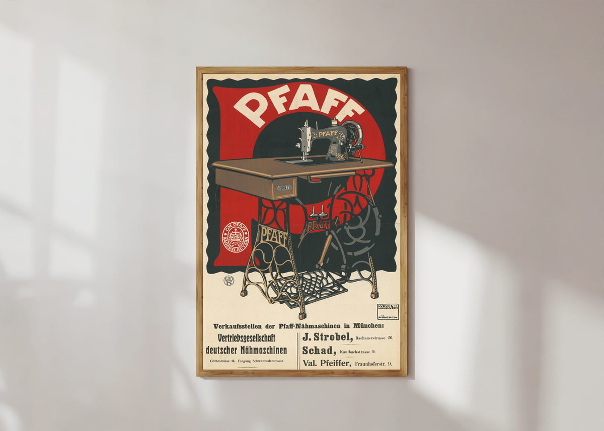Framed art print of Pfaff: Vertriebsgesellschaft deutscher Nähmaschinen in München by Ludwig Hohlwein, in a light wood frame on a sunlit white wall