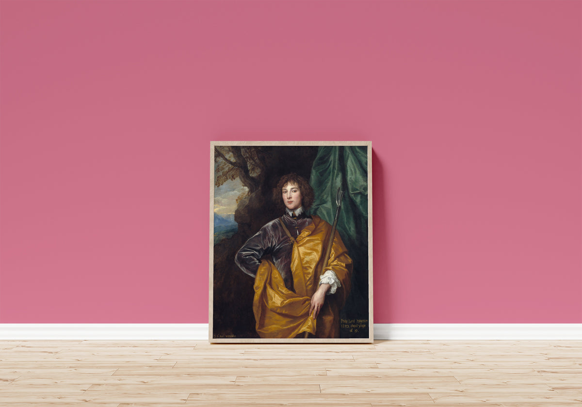 Framed art print of Philip, Lord Wharton by Anthony van Dyck, in a light wood frame leaning on a pink wall above a wooden floor