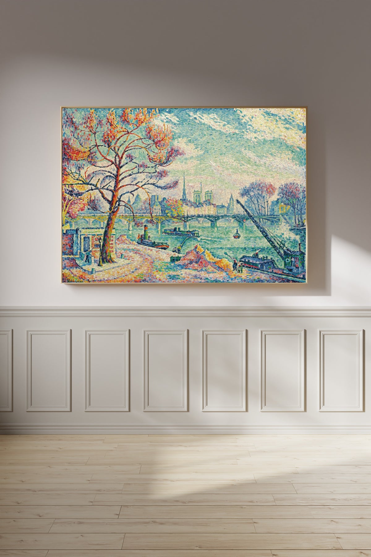 Framed art print of Pont des Arts, Paris by Paul Signac, on a panelled wall in afternoon light