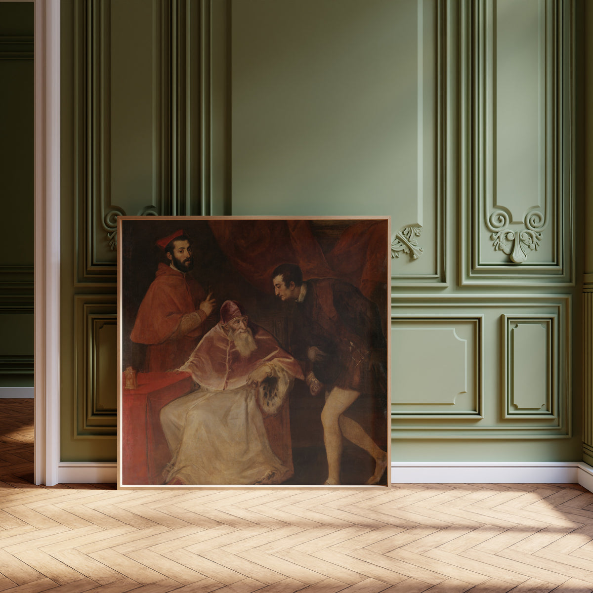 Framed art print of Pope Paul III and His Grandsons by Titian, leaning against olive-green panelling on a herringbone floor