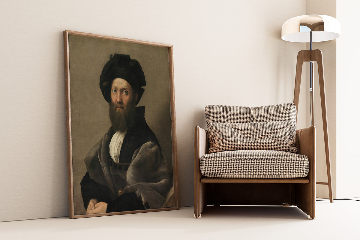 Framed art print of Portrait of Baldassarre Castiglione by Raphael, leaning against a wall beside an armchair and a floor lamp