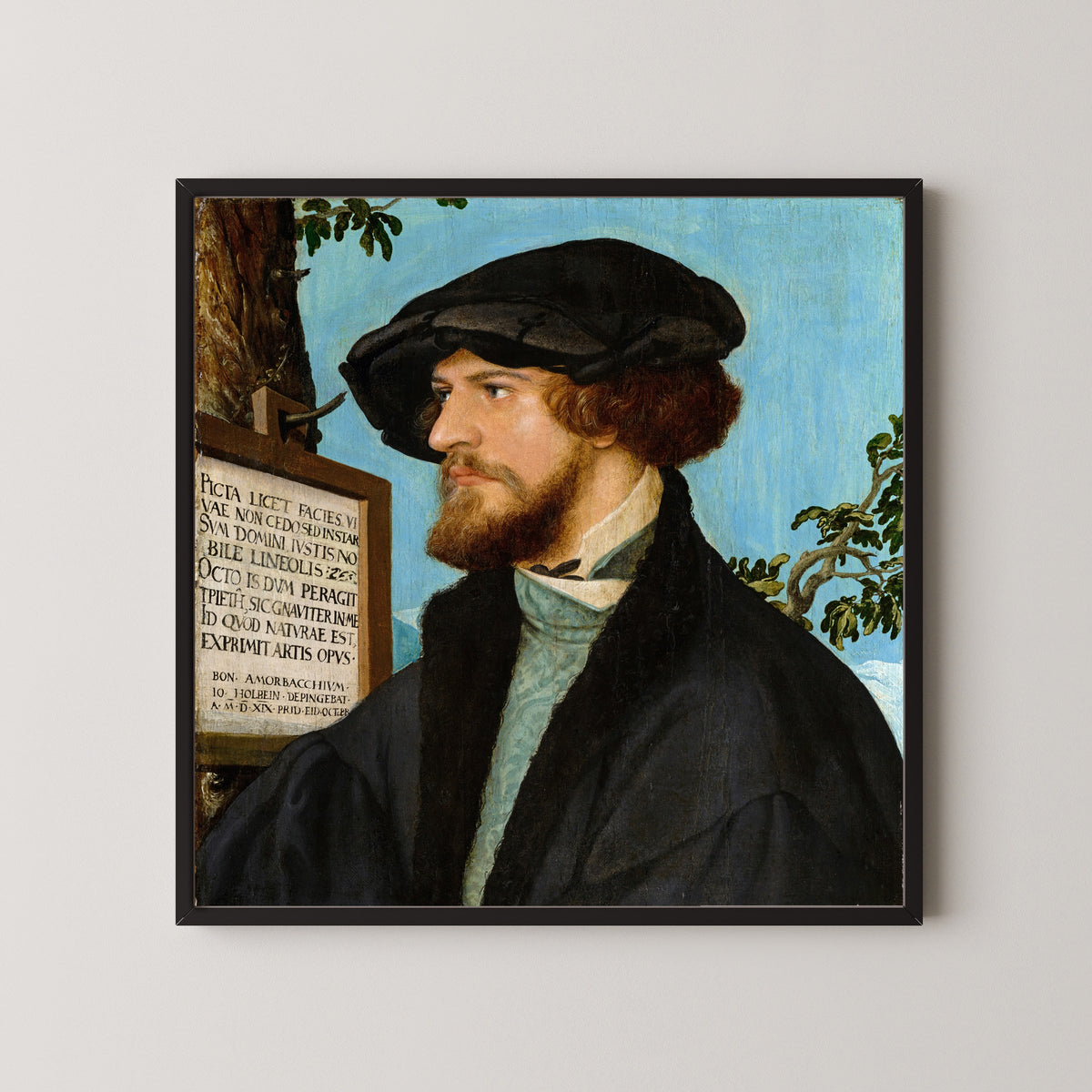 Framed art print of Portrait of Bonifacius Amerbach by Hans Holbein the Younger, in a black frame on a pale wall