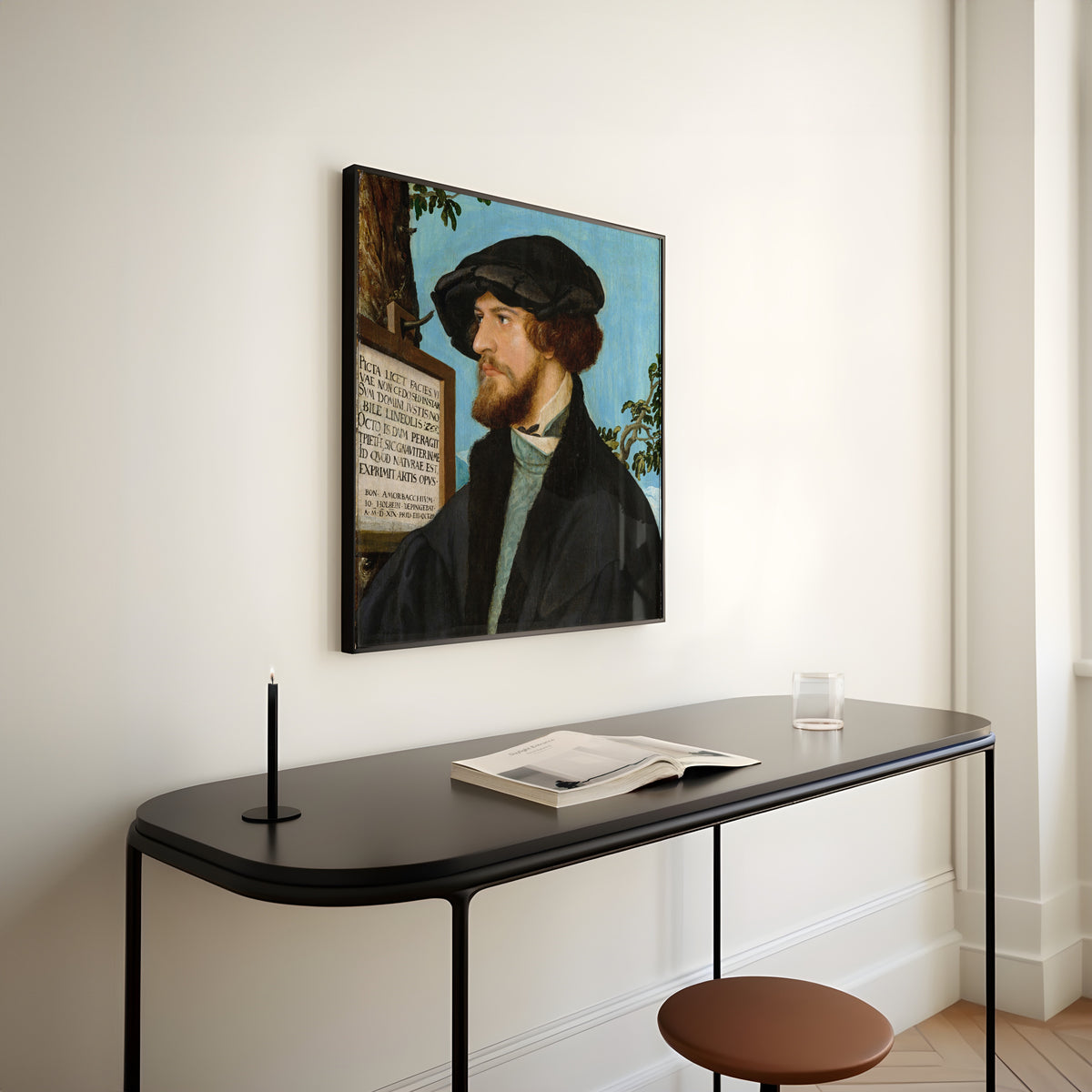 Framed art print of Portrait of Bonifacius Amerbach by Hans Holbein the Younger, above a slim black console table