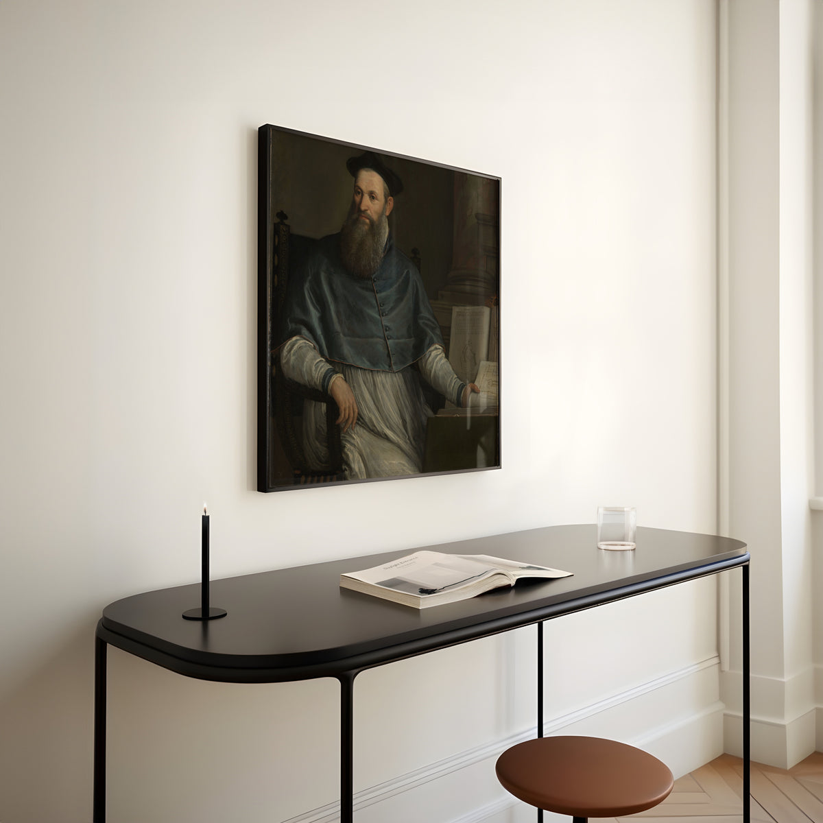 Framed art print of Portrait of Daniele Barbaro by Paolo Veronese, above a slim black console table