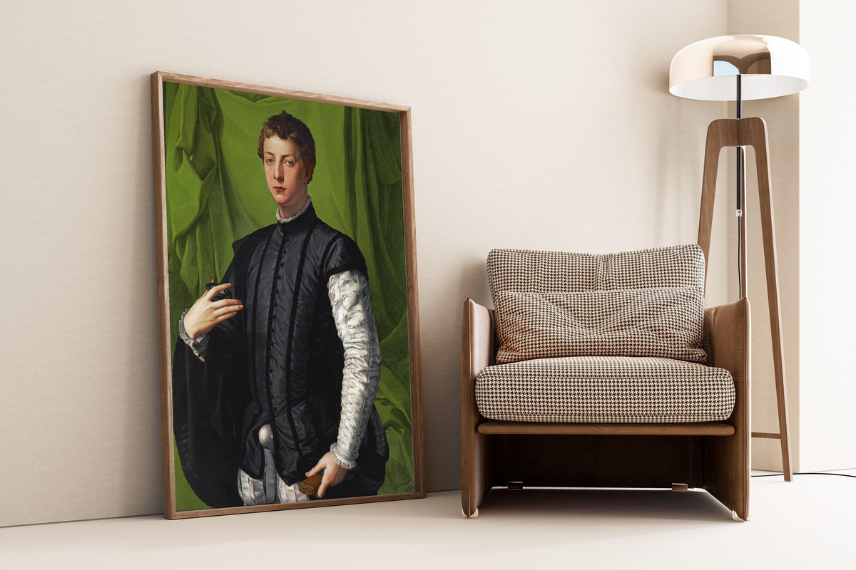 Framed art print of Portrait of Lodovico Capponi by Bronzino, leaning against a wall beside an armchair and a floor lamp