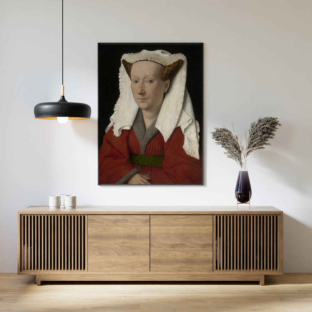 Framed art print of Portrait of Margareta van Eyck by Jan van Eyck, above a slatted wood sideboard