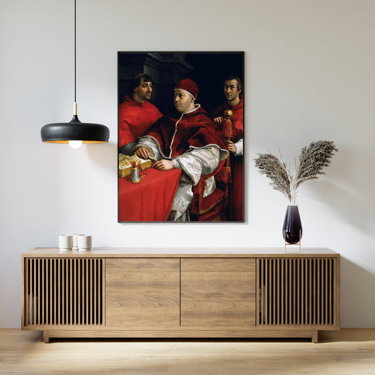 Framed art print of Portrait of Pope Leo X with Cardinals Giulio de’ Medici and Luigi de’ Rossi by Raphael, above a slatted wood sideboard