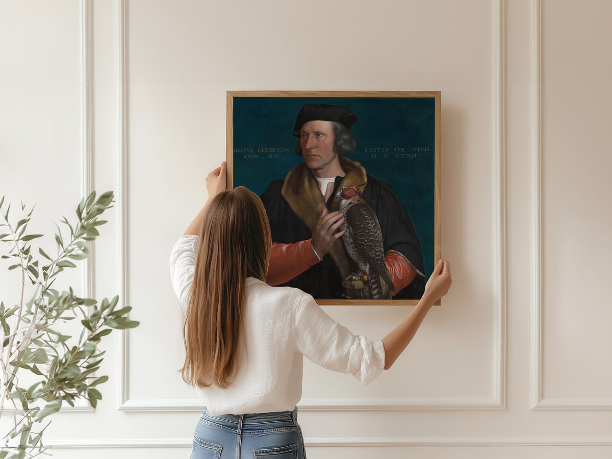 Framed art print of Portrait of Robert Cheseman by Hans Holbein the Younger, hung on a panelled wall