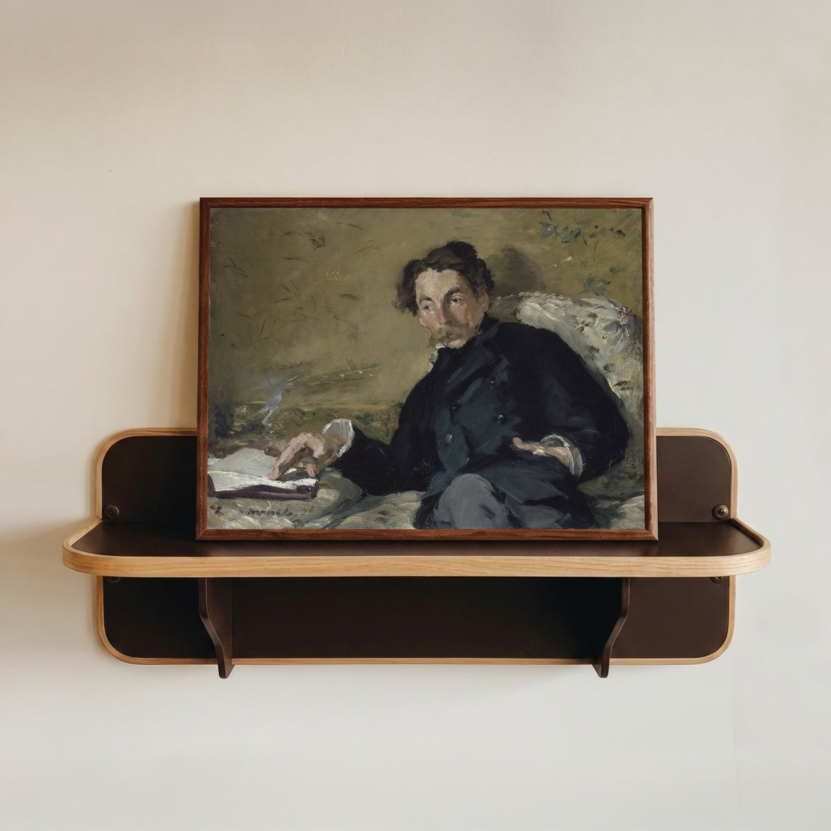 Framed art print of Portrait of Stéphane Mallarmé by Édouard Manet, in a dark wood frame resting on a wall shelf