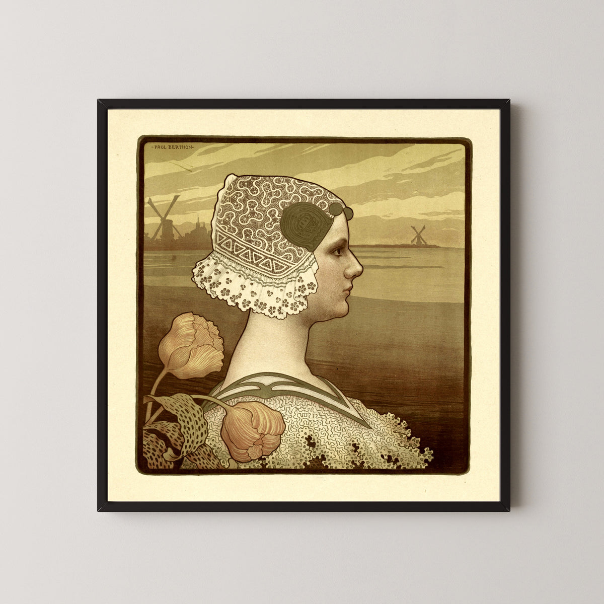 Framed art print of Portrait of Wilhelmina, Queen of the Netherlands by Paul Berthon, in a black frame on a pale wall