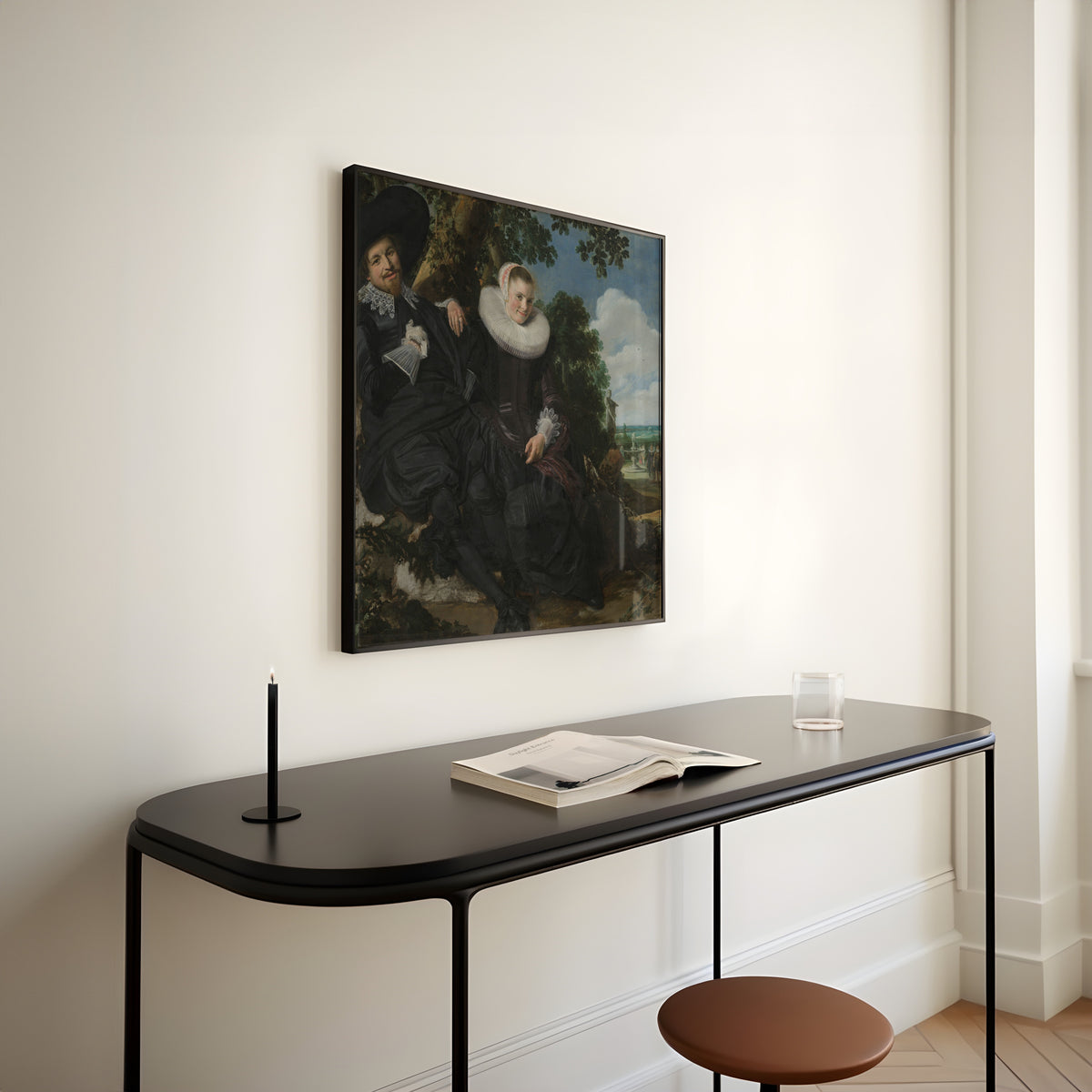 Framed art print of Portrait of a Couple, Probably Isaac Abrahamsz Massa and Beatrix van der Laen by Frans Hals, above a slim black console table