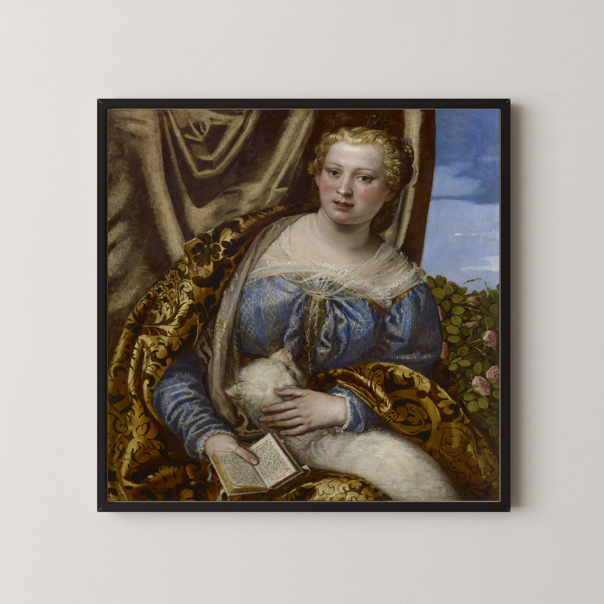 Framed art print of Portrait of a Lady as Saint Agnes by Paolo Veronese, in a black frame on a pale wall