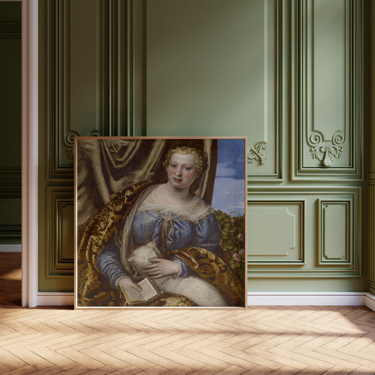 Framed art print of Portrait of a Lady as Saint Agnes by Paolo Veronese, leaning against olive-green panelling on a herringbone floor