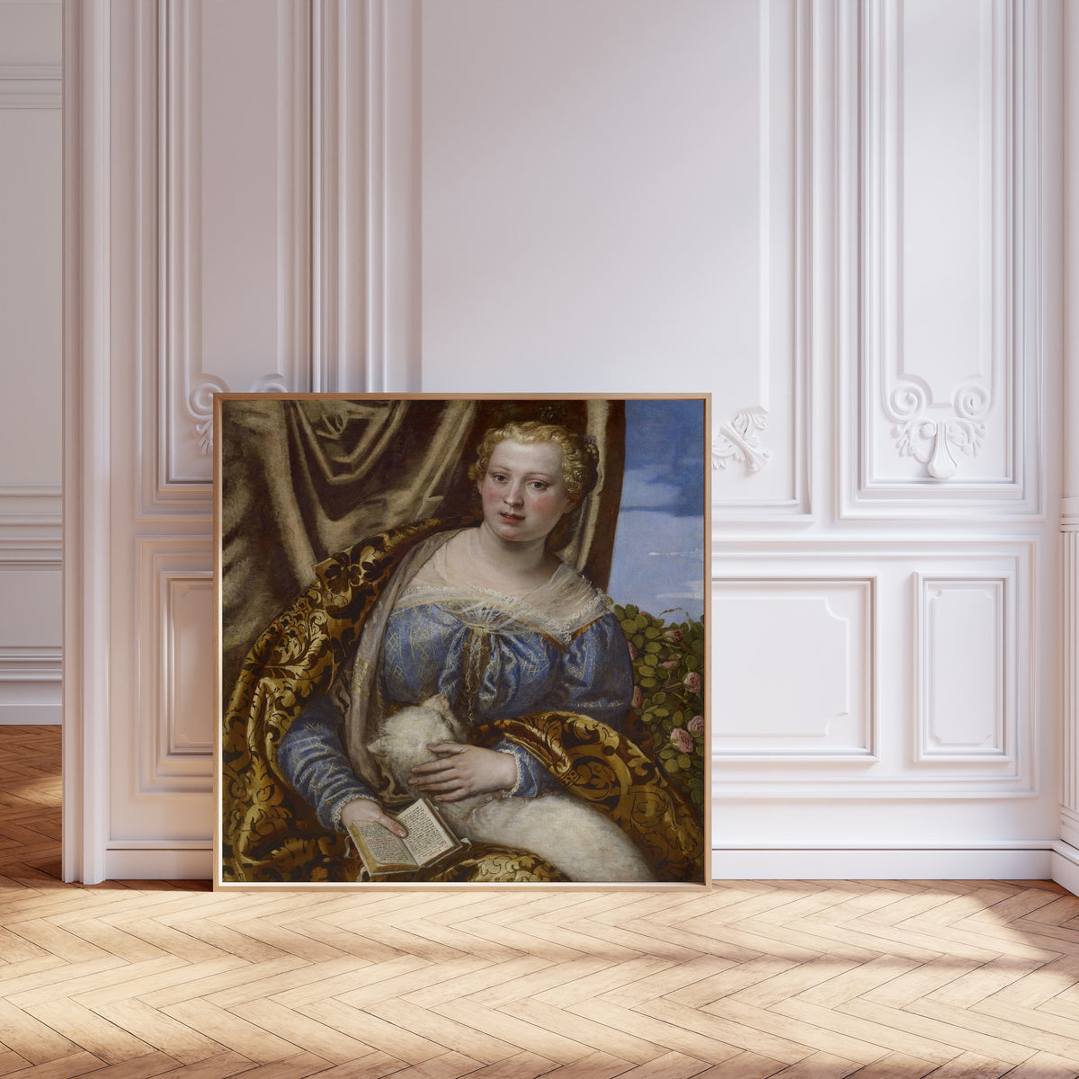 Framed art print of Portrait of a Lady as Saint Agnes by Paolo Veronese, leaning against pale pink panelling on a herringbone floor