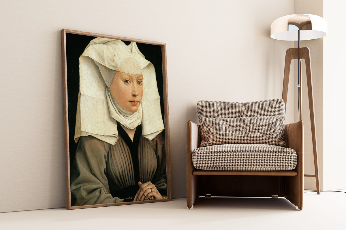 Framed art print of Portrait of a Woman by Rogier van der Weyden, leaning against a wall beside an armchair and a floor lamp