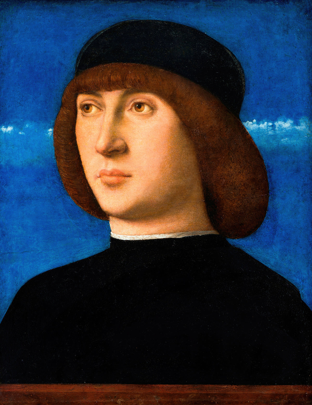 Portrait of a Young Man by Giovanni Bellini — A young man in a black cap against a vivid blue sky