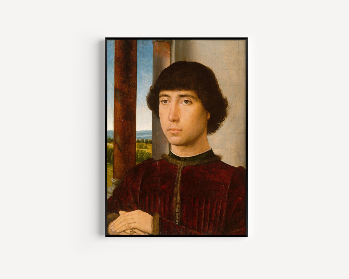 Framed art print of Portrait of a Young Man by Hans Memling, in a slim black frame on a plain white wall
