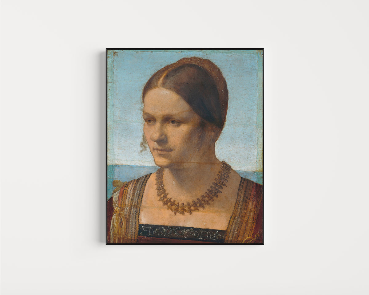 Framed art print of Portrait of a Young Venetian Woman by Albrecht Dürer, in a slim black frame on a plain white wall