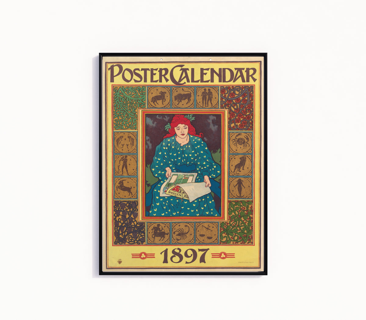 Framed art print of Poster Calendar, 1897 by Louis Rhead, in a slim black frame on a plain white wall