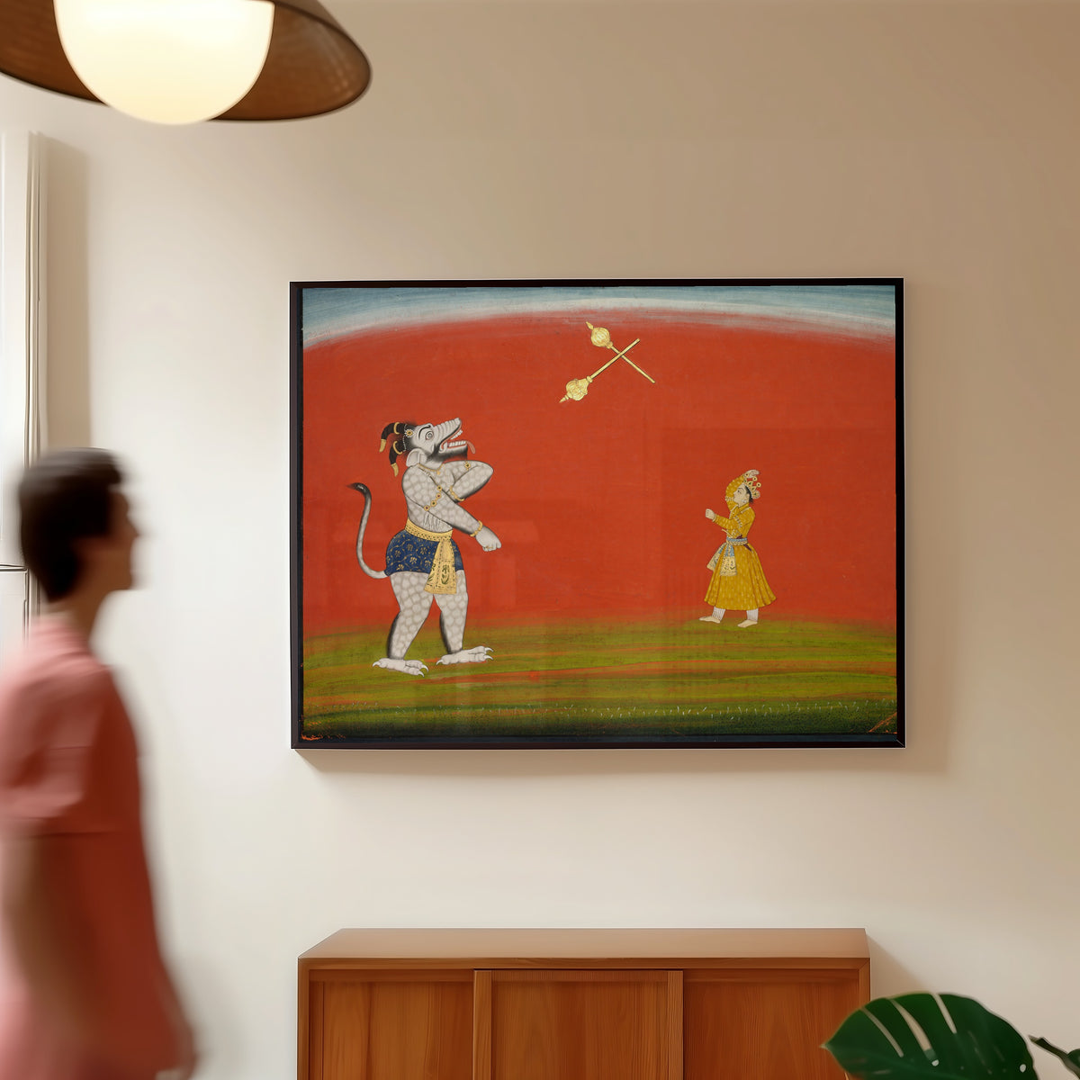 Framed art print of Pradyumna and Samvara Fight with Maces by Pahari school, in a slim black frame on a warm wall in a sunlit room