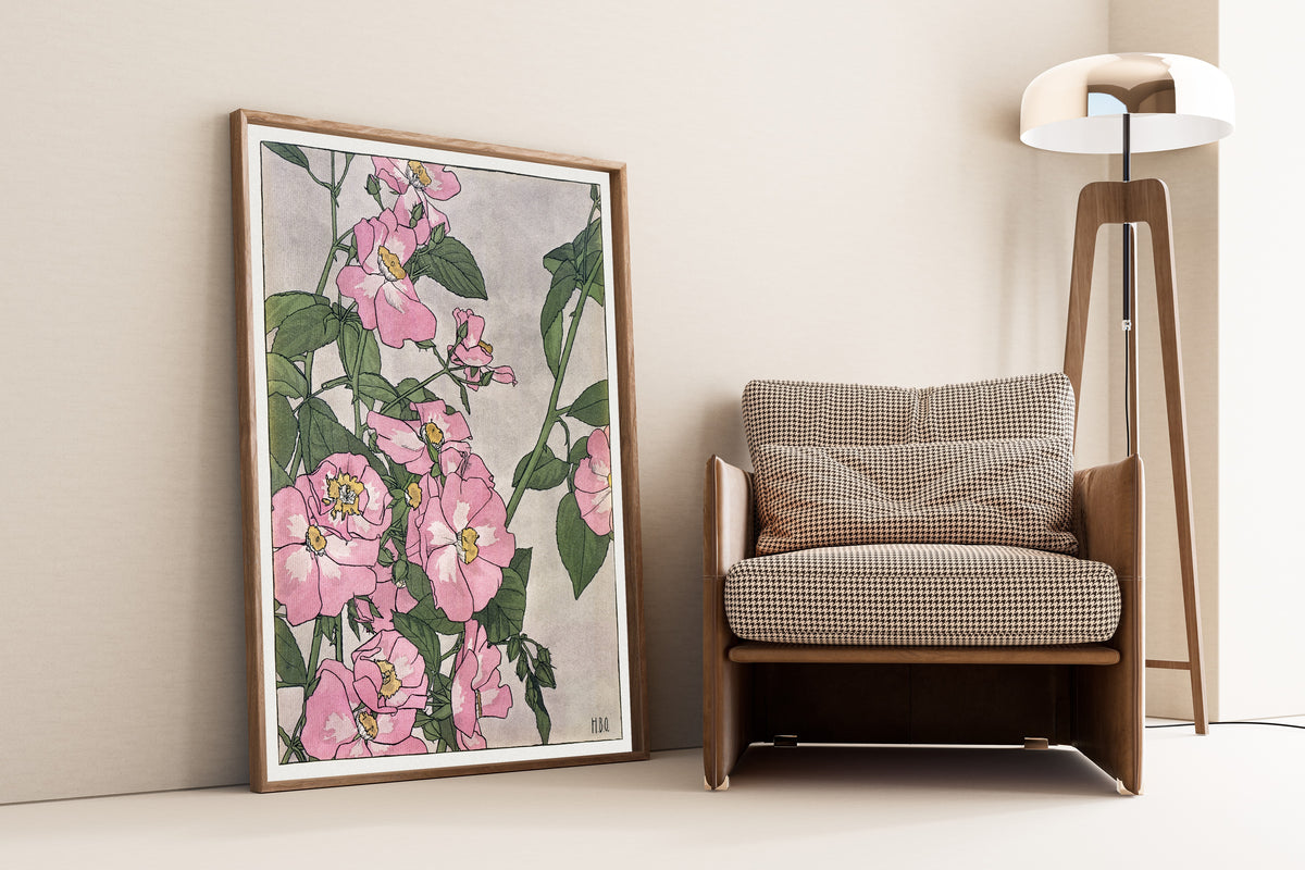 Prairie Rose by Hannah Borger Overbeck — framed and leaning against a wall beside an armchair and a floor lamp