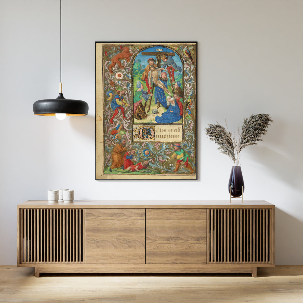 Framed art print of Prayer Book of Charles the Bold: The Deposition by Vienna Master of Mary of Burgundy, above a slatted wood sideboard