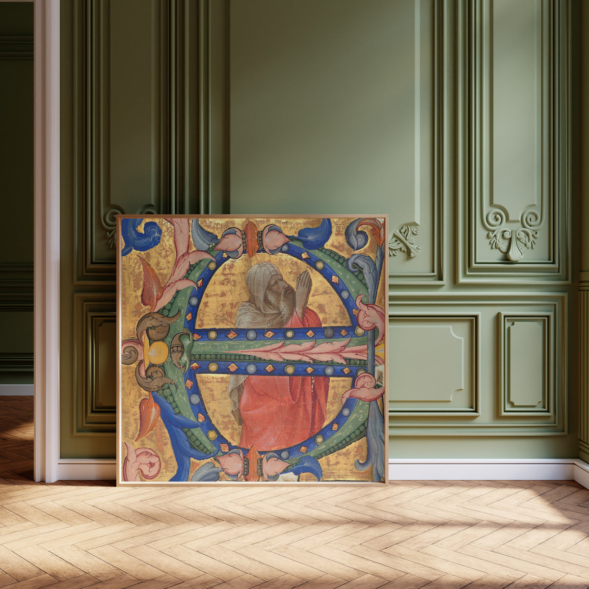 Framed art print of Praying Prophet by Lorenzo Monaco, leaning against olive-green panelling on a herringbone floor